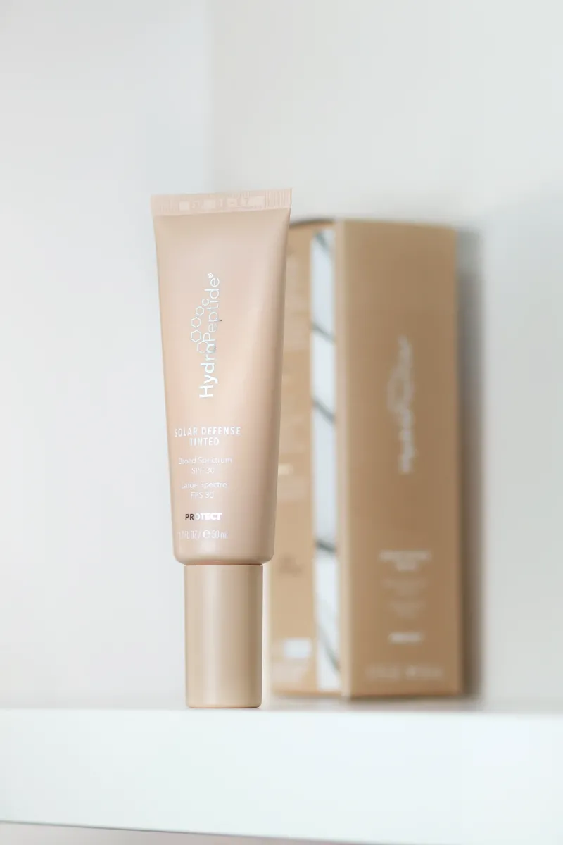 Сонцезахисний крем для обличчя з тонуючим ефектом HydroPeptide
